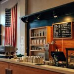 Local Partner - flag of U.S. America hanging on white painted concrete wall